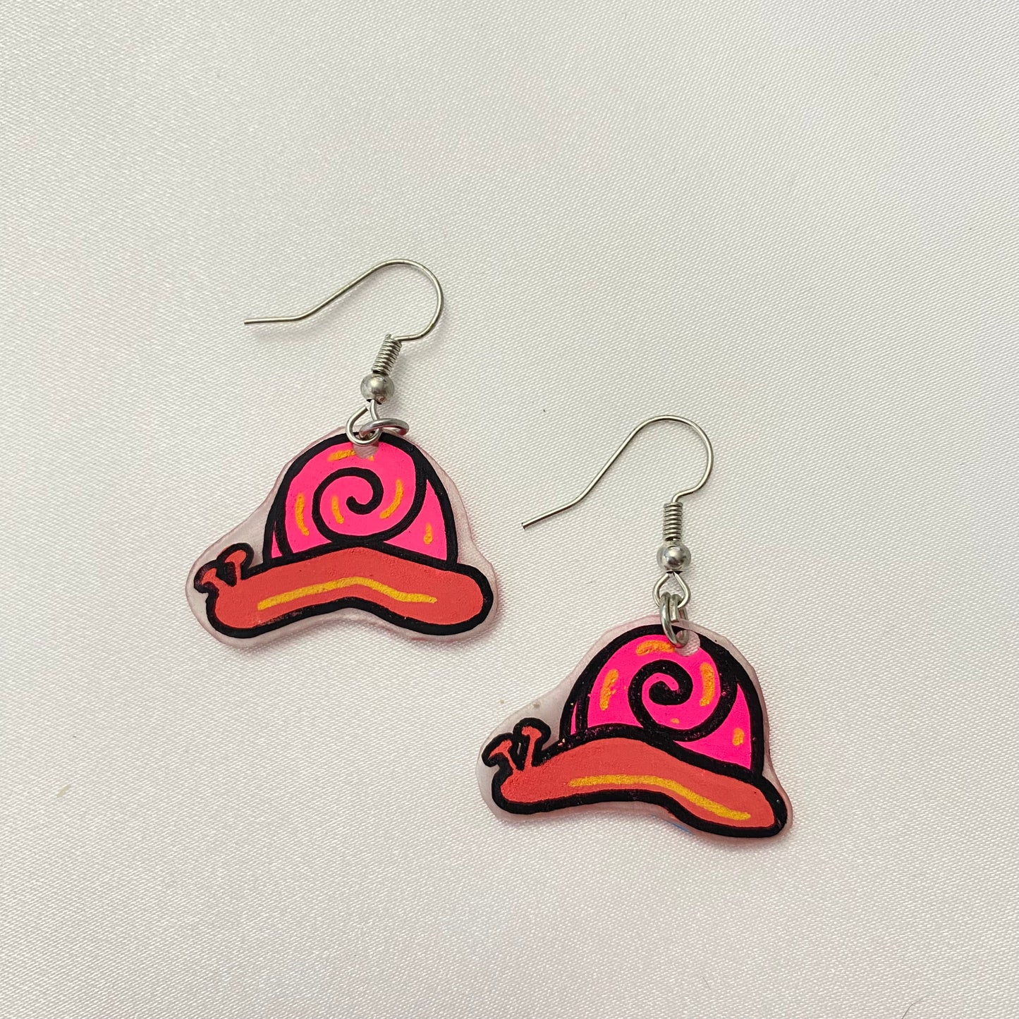peach snail earrings